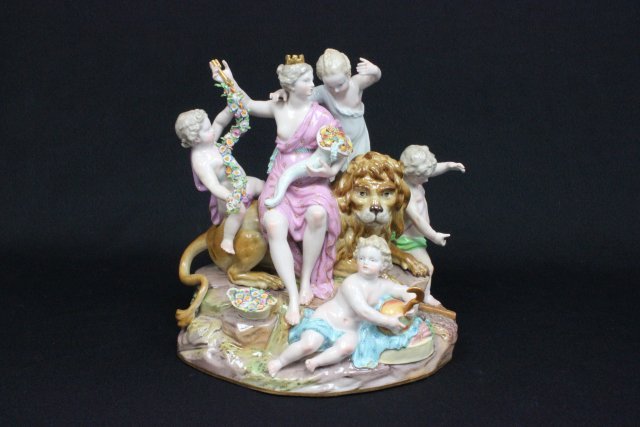 19th c. Meissen porcelain grouping"Europa": "Seated Queen on Lion, Surrounded by 4 Cherubs", losses & repairs, blue cross swords mark, incised mark D83. Approx. 10" H x 9.5" across. The property of a NYC gentleman's 20 year collection. Possible