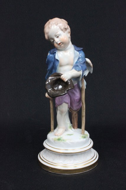 19th c. Meissen porcelain with Marcolini mark: "Cupid with Hat & Cane", incised mark L112, 28. Approx. 9.5" H. The property of a NYC gentleman's 20 year collection. Possible professional restorations.