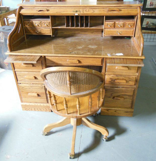 "S" oak roll top desk & matching desk chair: With full interior. Approx. 46" H at back x 54" across.