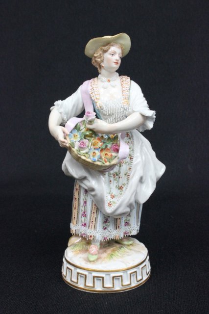 19th c. Meissen porcelain figurine: "Lady with Basket of Flowers", incised mark G72,127, blue cross sword mark. Approx. 6" H. The property of a NYC gentleman's 20 year collection. Possible professional restorations.