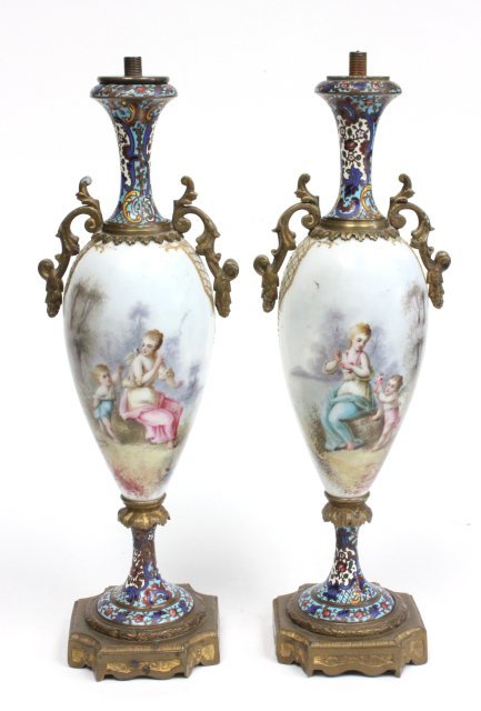 Pair porcelain & enamel garniture: Depicting "Woman & Putti", top missing. Approx. 13" H.