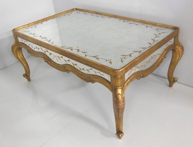 Gilt framed mirrored coffee table: Approx. 45.5" x 22" H x 32" D.