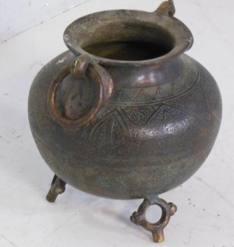 Persian bronze footed urn with loop handle: Etched design. Approx. 13" H x 12" D. From the Chateau des Thon, which originally was built and located outside of Dijon, France in the early 18th century.