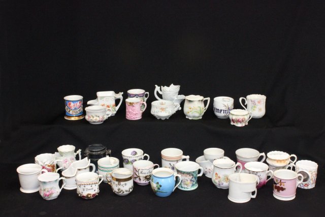 Large collection of mustache cups: 32 in total. Mostly 19th/20th c, some with lines.