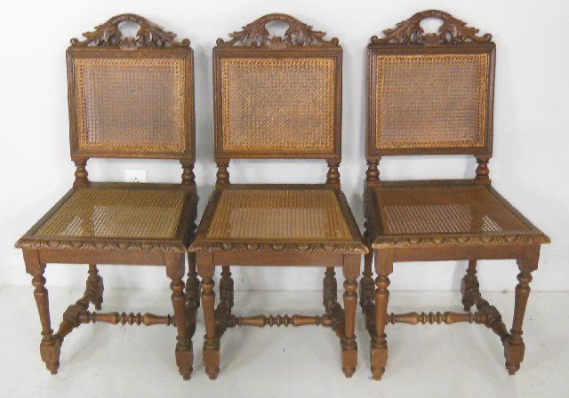 Set of 6 walnut dining room chairs: Caned seats.