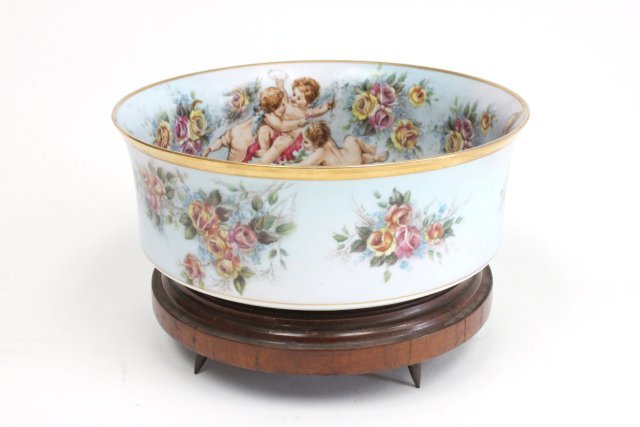 KPM porcelain handpainted bowl: "Cherubs & Floral" design. Approx. 3.25" H x 8" W on wood base.