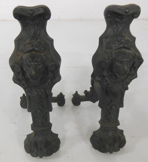 Pair of figural andirons: Pair of andirons with lion heads. Approx. 22" H.