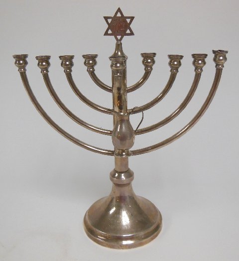 Sterling silver menorah: Some dings. Approx. 10.66 ozt, 13" H.
