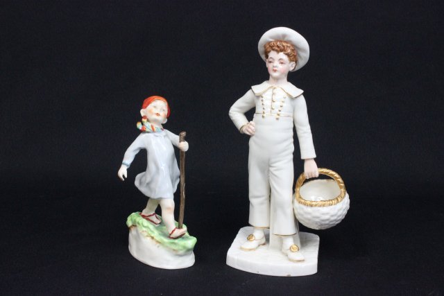 2 porcelain Royal Worcester figures: "Boy in Sailor Suit with Basket", approx. 9" H. "Boy with Walking Stick", approx. 6.5" H.