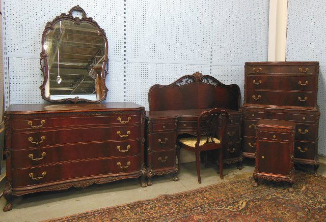 Carved mahogany bedroom set ca. 1930's: Consisting of: Chest, dresser, vanity, 1 mirror, chair & headboard. (3303)