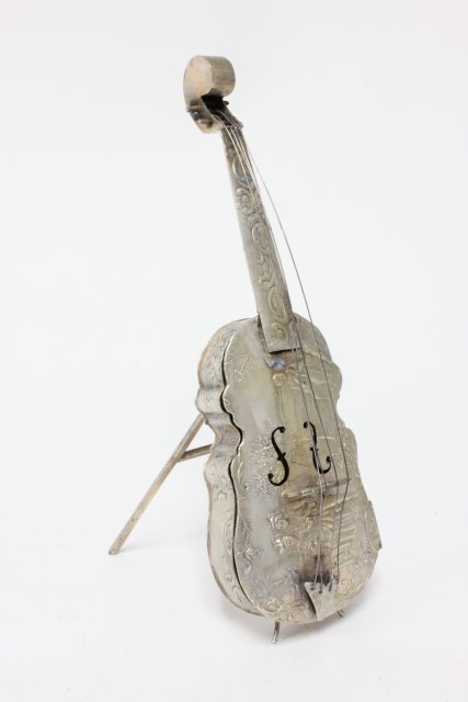 Silver Repousse Miniature Standing Violin: Silver repousse standing miniature violin. Depicting courting scene, opens. Some old restorations. Approx. 7 1/2" high