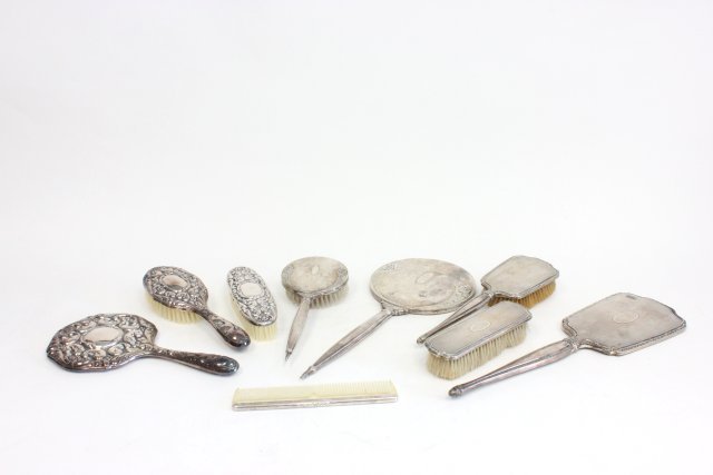 3 3 piece sterling silver vanity sets: Including: 2 with hand mirror, hair brush, & clothing brush; 1 with hand mirror, hair brush, & comb. 1 monogram MED. Minor dings.