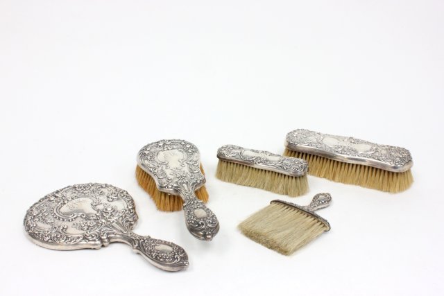 5 piece sterling silver vanity set monogrammed: Including hand mirror, hair brush, shoe brush, clothing brush, & handled brush.