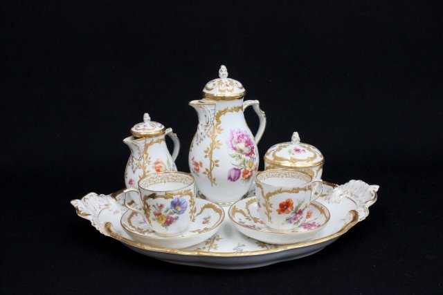 KPM tea set: Tray, coffee pot, teapot, cup, saucer, sugar bowl. Cup has line, 1 lid repaired. Tray approx. 16" W, 8.5", 5.25".