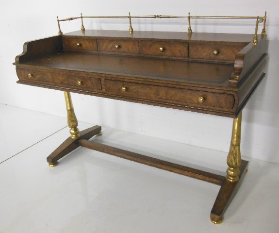 Maitland Smith Walnut and Brass Desk: Mid century walnut leather top desk with brass gallery and legs. Approx 38" h, 51 1/2" w, 25 1/4" d.