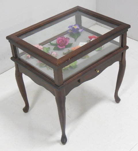 Display cabinet with 7 bisque flowers: Display cabinet with 7 bisque flowers From the estate of Duncan Thecker.