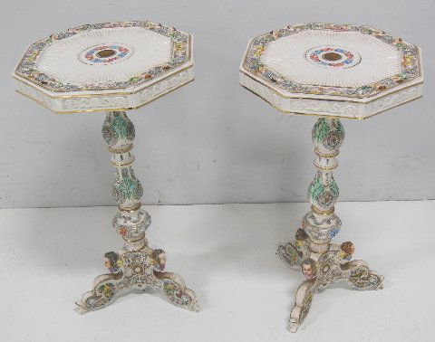 Pair Capodimonte tables: Porcelain figural ocatagonal tops. Approx. 22.5" H x 12.5" W.