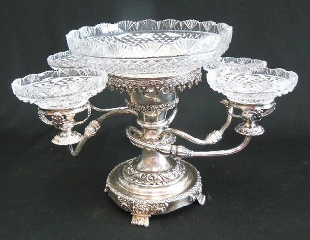 Crystal & Silver plate epergne: 4 arm centerpiece. Small chip on one small cup. Approx. 11.5" H x 15" across.