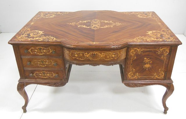 Mahogany & satinwood partners desk: With mother of pearl inlays, carved legs, inlaid top & drawers. Approx 31.5" H x 54" x 36.5".