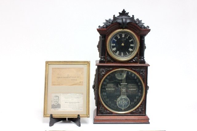 Ithaca double dial calendar clock: Parlor 3 1/2, oak case. 20 1/4H x 9 3/8, with original etched glass pendulum and documentation from Ithaca Calendar Clock Co. extremely rare and in perfect condition