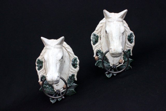 Pair of cold patinated horsehead door knockers: (3235)