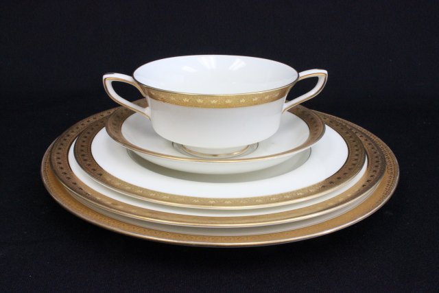 Two partial dinnerware sets: Including Royal Worcester in Ambassador pattern 6 salad plates, 8 dinner plates, 6 saucers, 7 boullion cups, and 7 Limoges plates. Total of 34 pcs. Collection from Estate of Chalmers Benedict Wood, Fo