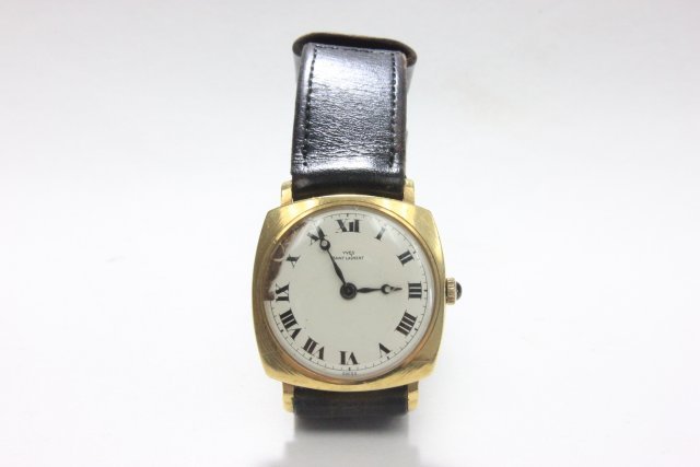 Mens gold Yves St. Laurent wristwatch: Face damaged. Not working.