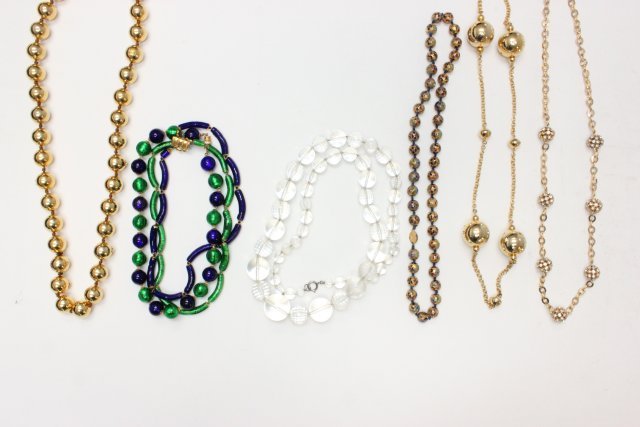 Lot of 6 vintage costume necklaces: Including: enamel painted beaded necklace, Coco Chanel stamped gold tone beaded necklace, blue & green glass necklace, 2 rhinestone beaded necklaces & clear plastic beaded necklace. As is. All costume