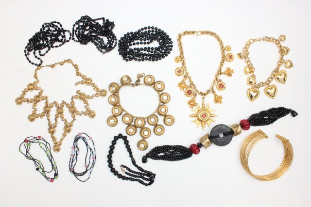 Vintage costume jewelry necklace lot: Including: KJL (Kenneth Lane) gold tone necklace with "Dangling Hearts", approx. 30" L. Gold tone cuff necklace, gold tone metal & rhinestone necklace, gold tone necklace & 6 necklaces with black bead