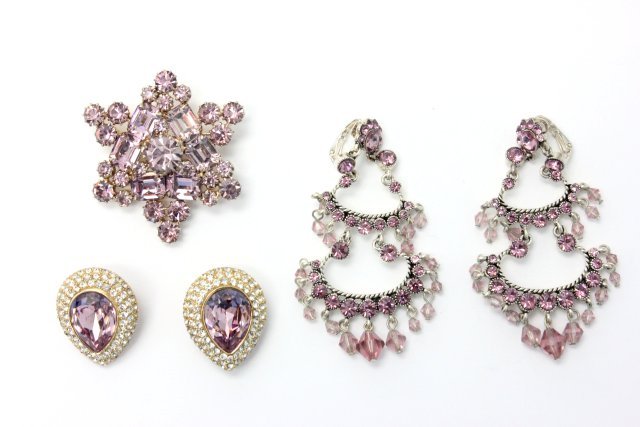 Group lot of costume jewelry: Including - 1- Weiss lavendar brooch; 1 - pair of lavendar chandelier earrings unmarked; 1 - pair of Ciner lavendar tear drop & rhinestone earrings.