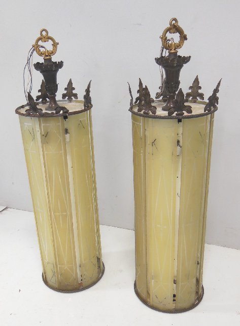 Pair of glass & metal cylindrical light fixtures: Approx. 51.5" H x 17" diam. 1 glass panel broken. Several glass panels loose from fixture. Piece needs tightening.