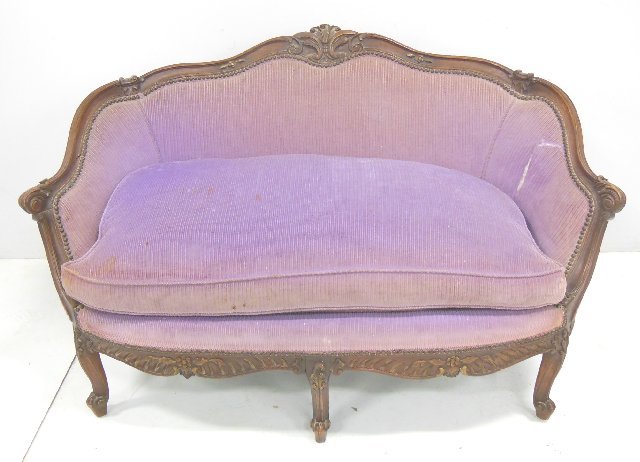 Heavily carved 1920's French style settee: Goose down cushion, some rip in fabric. Approx. 28" h, 53" w, 21" d.