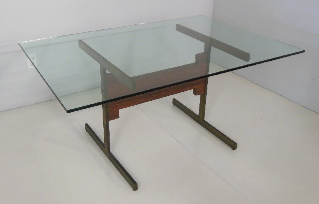 Modern glass top dining room table: With rosewood & brass base. Approx. 40" W x 60" L x 29 " H.