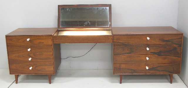 George Nelson Herman Miller Thin edge vanity: Wear to finish, signed in drawer. 3 pcs rosewood unit with lit vanity. Approx. 18.5" D x 27.5" H x 88" L.