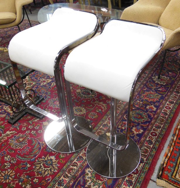 Pair of chrome with leather seat bar stools: Approx. 32" h, 18" d, 14" w.