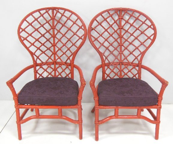 Pair mid century red painted rattan peacock chairs: With purple cushion. Approx 48.5" H x 29" W x 26" D.