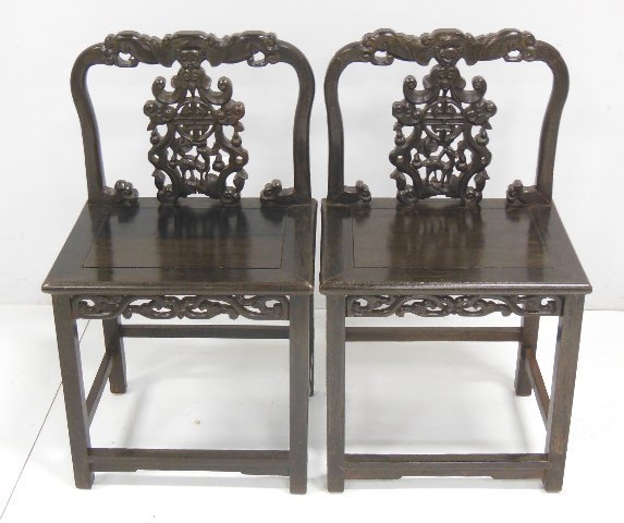 Pair carved Chinese rosewood throne chairs: Approx. 36" H x 20" W x 16.5" D.