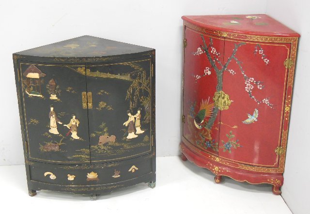 Two Chinese corner cabinets: 1- Red paint decorated corner cabinet with "birds & tree" decor. Approx. 37" H x 28" W x 19.5" D. 1- Black cabinet with Chinese figures & Chinoiserie decoration. Bone & soapstone. Approx. 28" W x 18.5