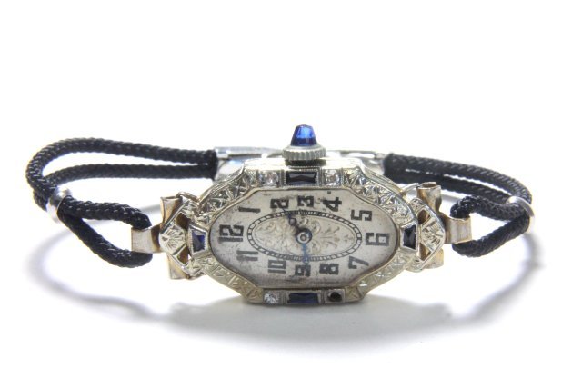 18k diamond, platinum, & sapphire "Bruner" watch: Ladies Art Deco watch. Approx. 7.7 dwt total. (Minor dent on reverse).