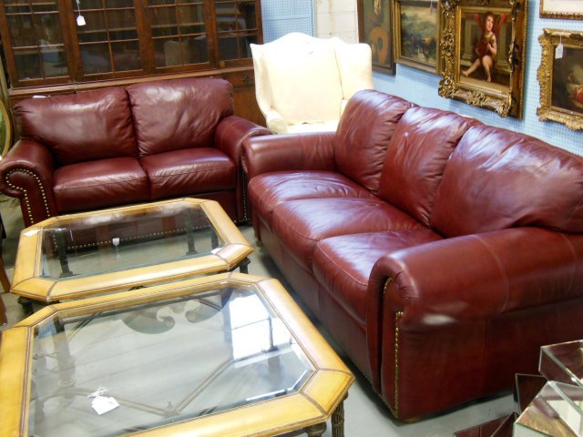 Leather sofabed & loveseat: Excellent condition, merlot leather color with large nailheads detail. Sofa with 3 cushions approx. 84" x 36" W x 36" H, loveseat with 2 cushions 64" x 36" W x 36" H.