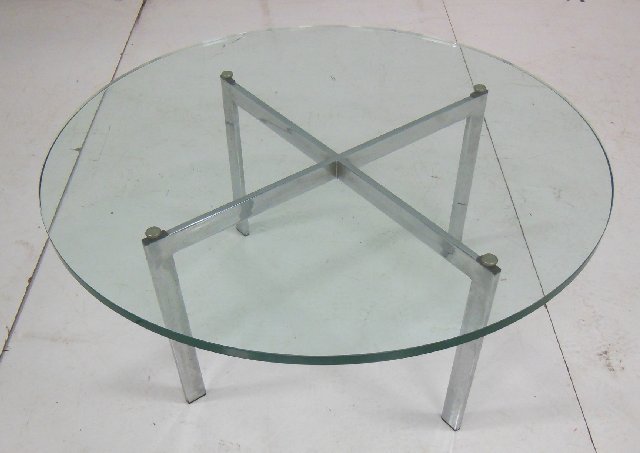 Modern round glass top coffee table: With chrome & wood legs. Approx. 16" H x 35.5" W.
