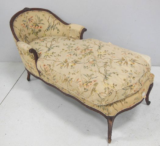 French carved walnut chaise lounge: With down cushion. Approx 5' L, 32" H at back, seat 30" W x 5' L.