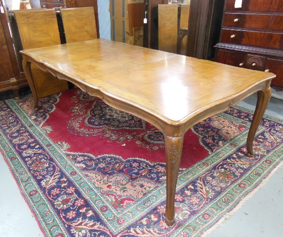 Baker Company country French dining room table: With 4 leaves. Approx. 28.5" H x 42.5" W x 7' W with leaf 20".