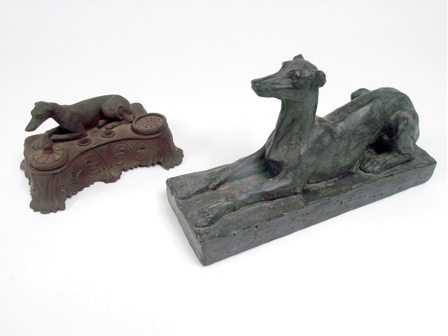 Ceramic inkwell with hound & wood sculpture: From the estate of Chris Peckham, A Victorian ceramic inkwell with recumbent hound together with a carved wood recumbent whippet the inkwell 7 1/2"W good condition