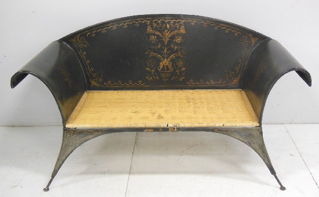 Black Tole peinte gilt decorated sofa: From the Estate of Chris Peckham. Approx. 34.25" H x 63" W x 31" D. Scratched.