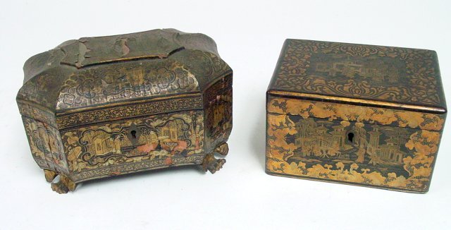 2 Chinese black & gilt tea cannisters: From the Estate of Chris Peckham. 1- with tin liner, approx. 4" H x 6.25" W x 4.5" D. 1 - pewter, with insert, missing some lacquer and pewter insert, approx. 5" H x 8" W x 5.5" D, As is.