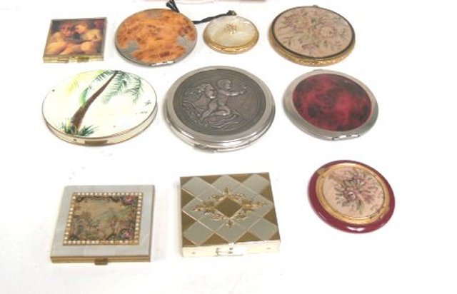 10 Ladies Compacts: Including 1 - with mother of pearl inlay, 1 - with music box, and several with tapestry designs. From the estate of Anita Stern, owner of This-N-That antiques store, NYC.