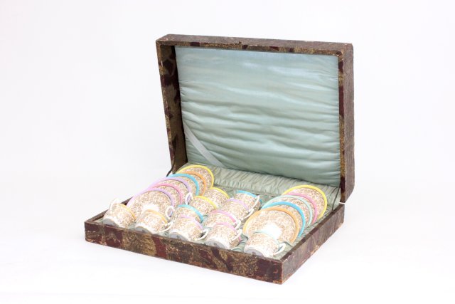 Royal Worcester Demitasse Set in Fitted Case: 19th century. Set consisting of 11 plates and cups. Crack in one plate. (3378).
