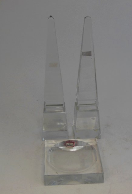 Pair Baccarat obelisks & Baccarat glass tray: Obelisks approx. 9.75" H. Tray approx. 3.75" W. Good condition. From the estate of Chris Peckham.