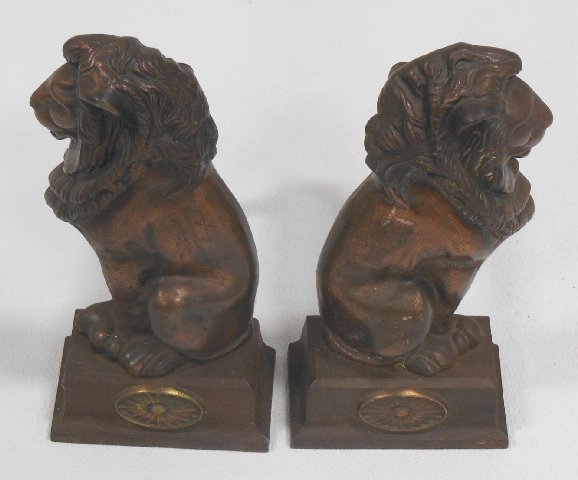 Copper on cast iron lion andirons: Approx. 15" H x 7" W. From the Estate of Chris Peckham.